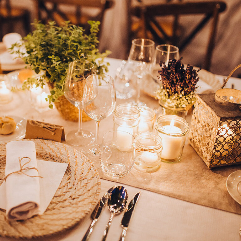 Greenery and ivory candle table setting for a winter wedding at Selden Barns